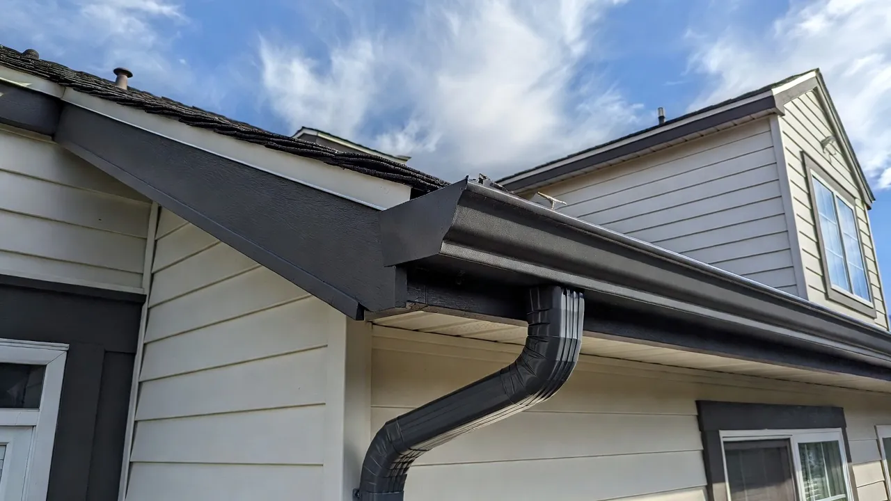 Seamless gutter installation on a Spokane home — new aluminium gutters with correct pitch and secure hangers